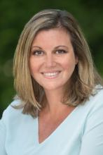 Danielle smiling in a blue shirt