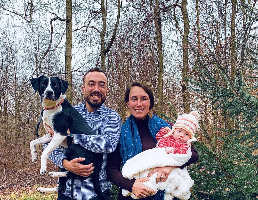 young woman and man with dog and baby