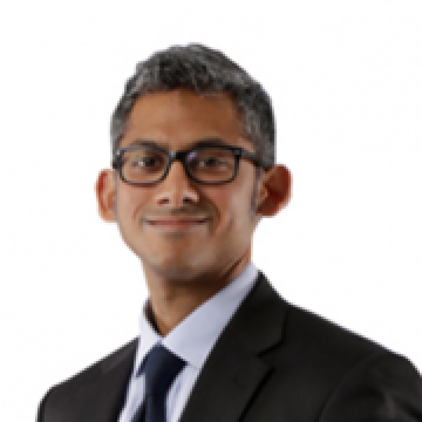 smiling man in suit of sub continental asia with glasses