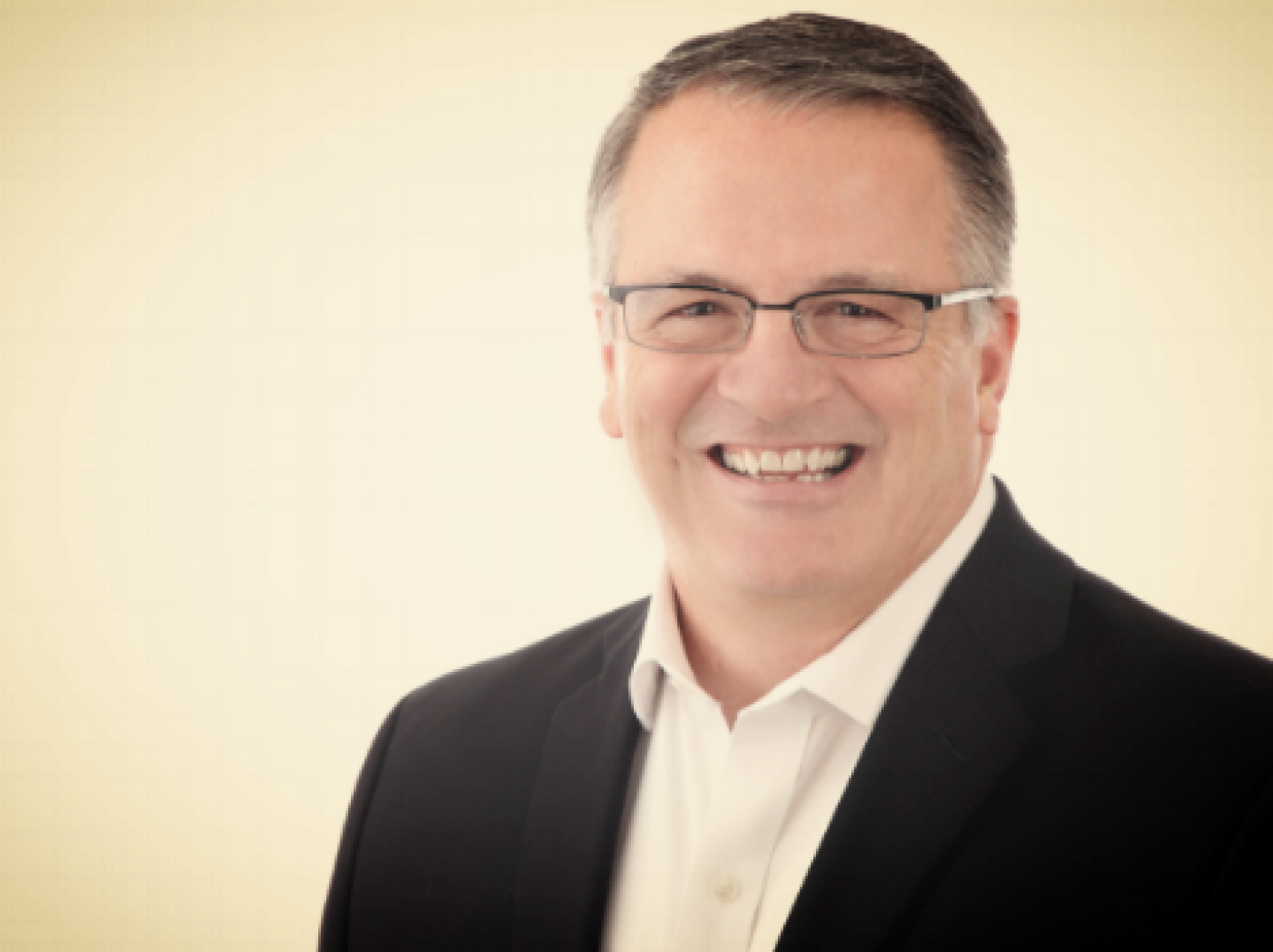 Smiling Man with Glasses