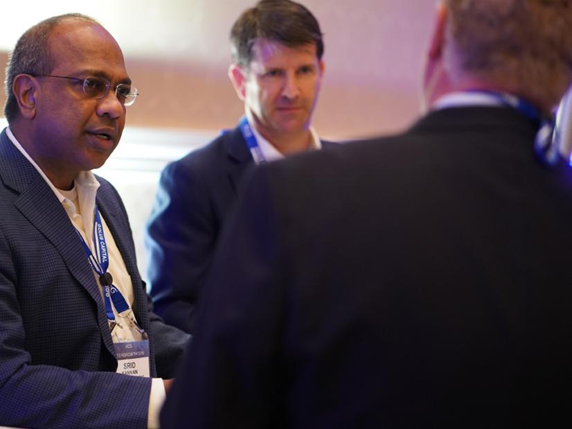 Three ACG colleagues chatting together