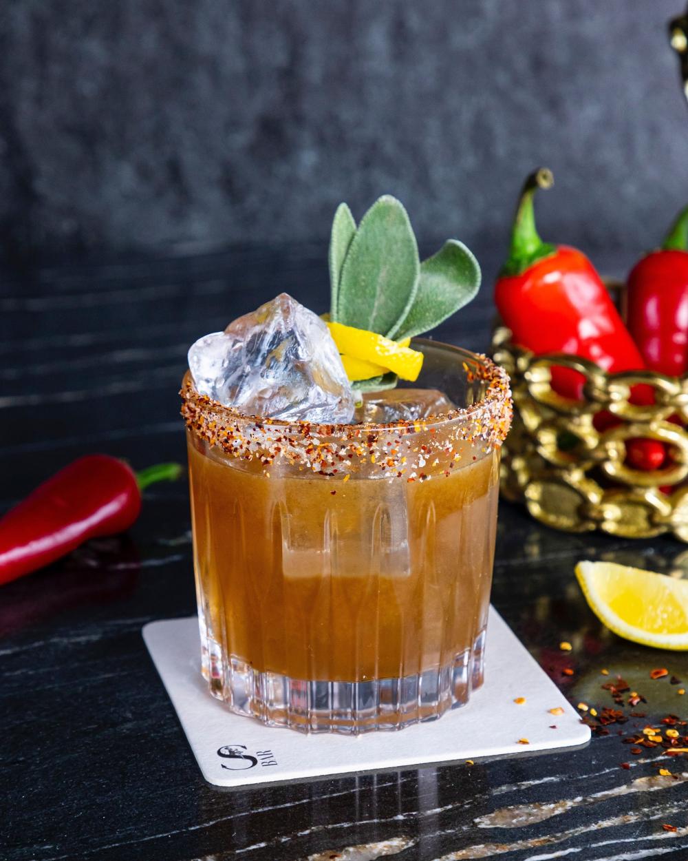 A picture of a brown cocktail drink