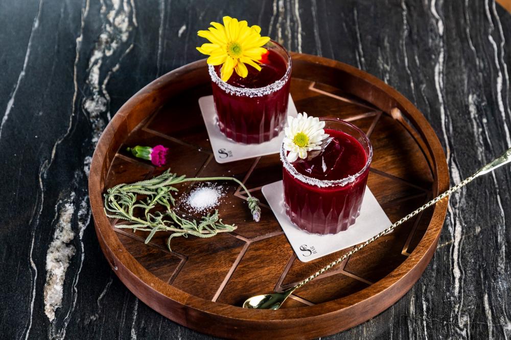 A picture of a red cocktail drink.