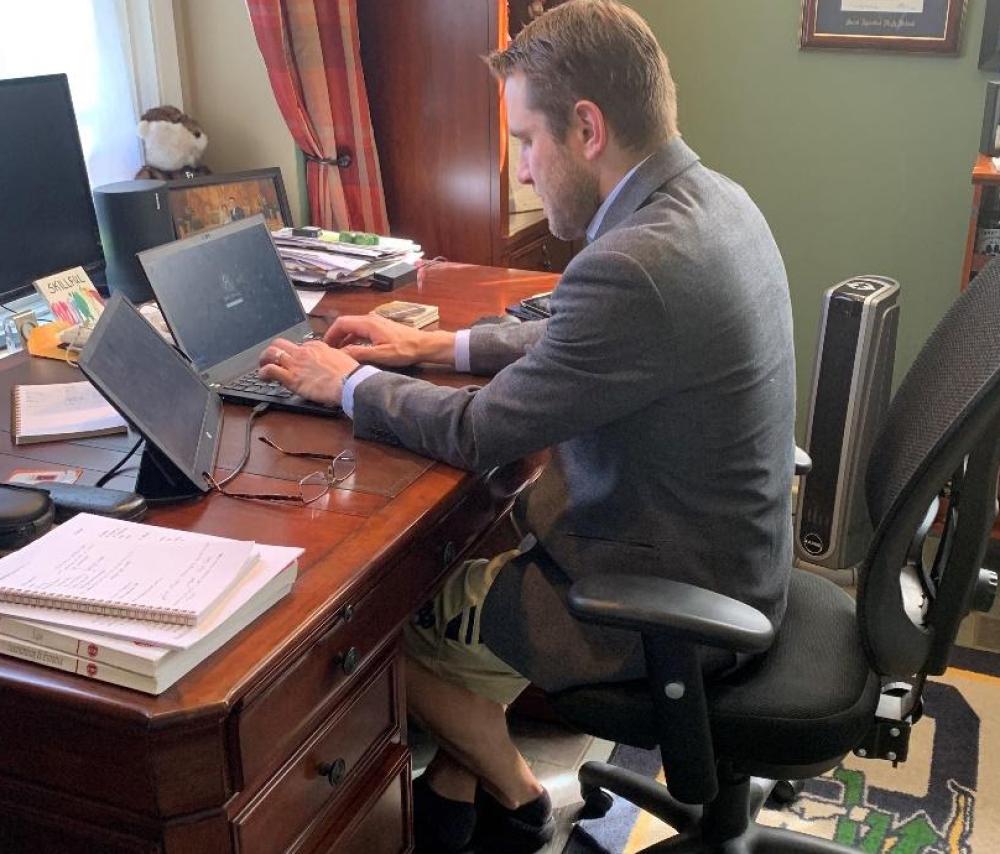 mike sitting at his computer